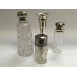 Two silver topped glass scent bottles plus one other and a silver plated bud vase (4).