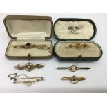 Six gold bar brooches including stone set Edwardia