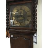 A oak cased 8 day long case clock the brass dial with Roman numerals and date aperture maker rich