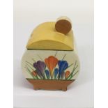 A Clarice Cliff 'Bonjour' shape 'Crocus' pattern preserve pot.Approx 11cm, overpainted lid.