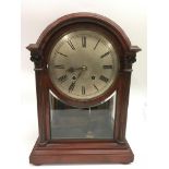 A mahogany clock in three glass case with silver dial. Approx 44cm high