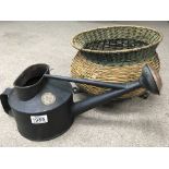 A Victorian Hawes watering can with copper Rose and a cauldron shaped wicker basket on feet