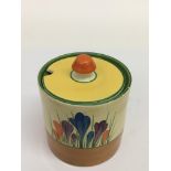 A Clarice Cliff 'Crocus' pattern preserve pot. Approx 11cm, small chip to underside of base