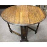 A small oak swivel top table - NO RESERVE