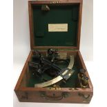A wooden cased sextant.