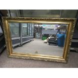 A gilt framed wall mirror, approx 85cm x 59 cm.