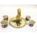 A rare Clarice Cliff 'Duck' stand with four 'Crocus' pattern eggcups. Approx 15cm, some overpainting