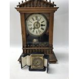 A small zenith brass travel clock in original case and a walnut case mantle clock striking on a bell