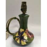 A Moorcroft style ceramic lamp base, approx 24.5cm.