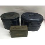 Two metal military hat boxes and an ammunition tin