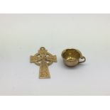 A 9ct gold celtic cross pendant and a miniature 9c
