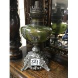 A Victorian oil lamp base with green font on plated base 27 cm .