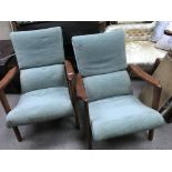 A pair of 1960s/70s G plan upholstered armchairs.