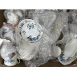 A box of vintage tea and dinner china