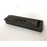 An unusual old carved wooden box with lizard on to