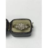 A Edwardian style diamond cluster ring with worn g
