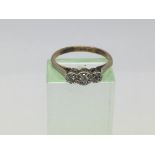 A 9ct gold and platinum three stone diamond ring,