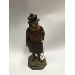 A vintage cold painted spelter figure of a beefeat