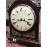 A Georgian mahogany bracket clock the painted dial with Roman numerals on gilt circular feet with