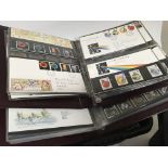 A collection of stamp albums containing unused Decimal Mint stamp packs and first day covers and a