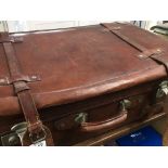 A large Quality leather vintage suite case with external leather straps. 76x47x41cm.