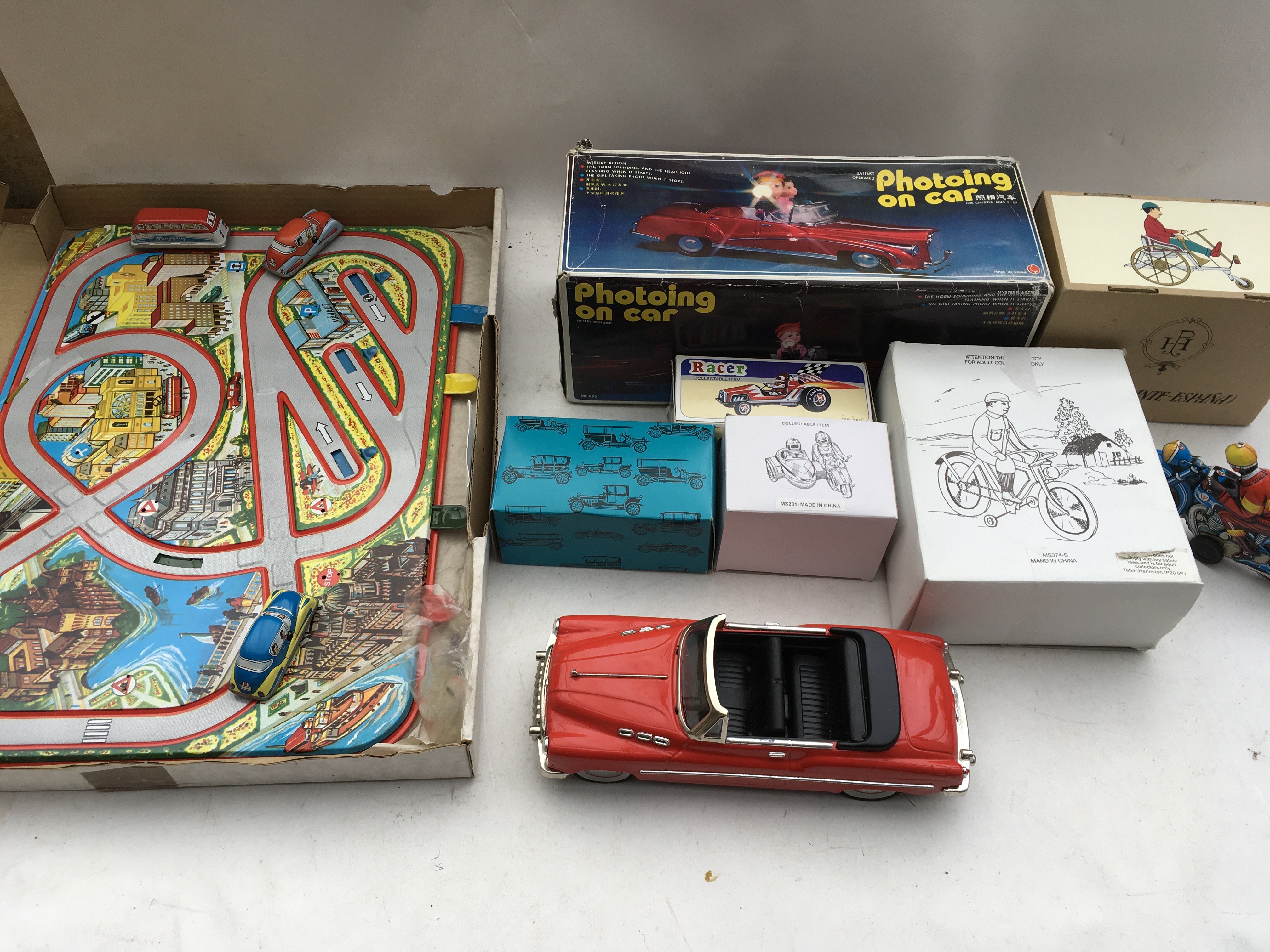A box containing a collection of boxed tinplate re