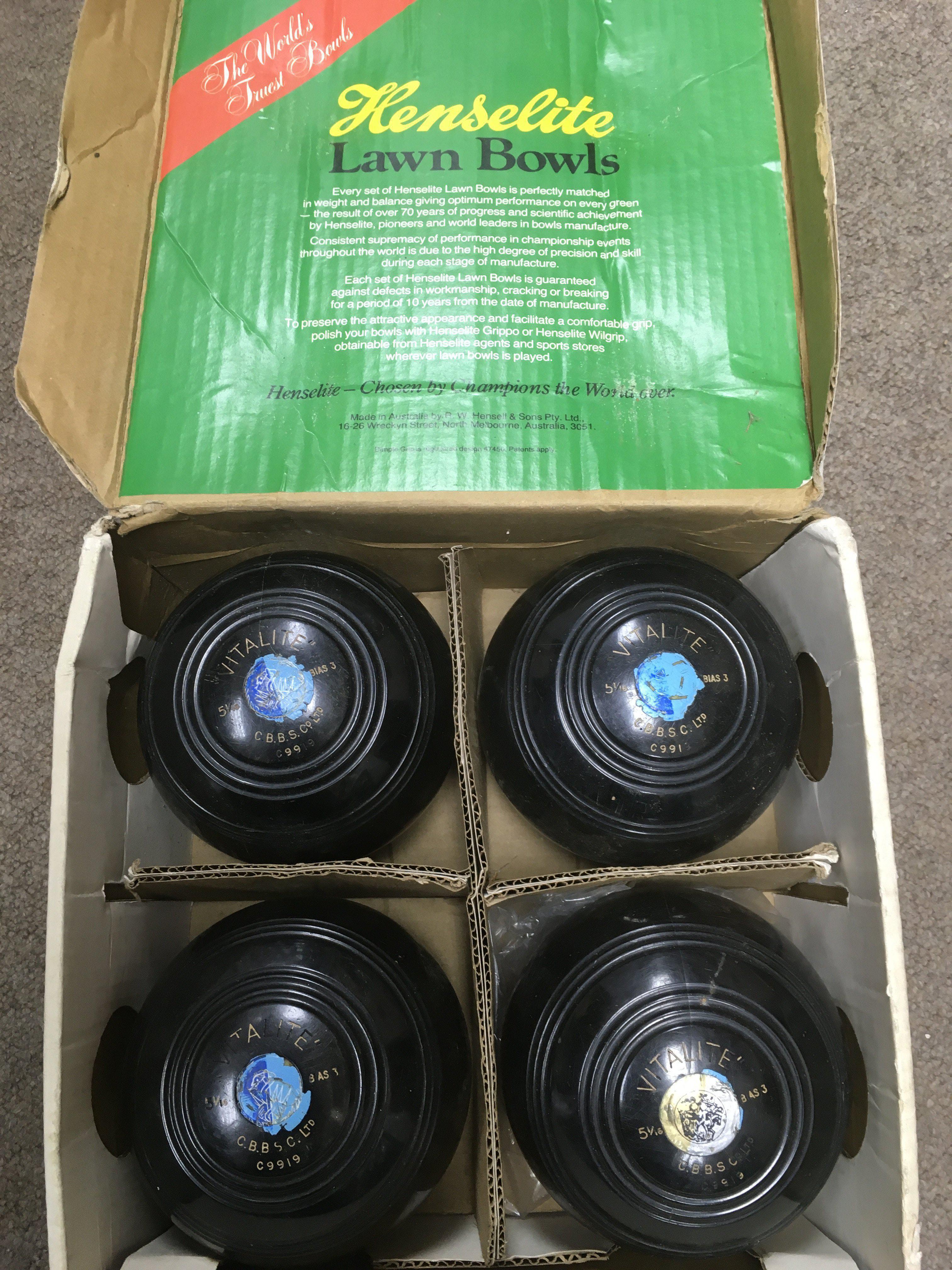 A cased set of four Henselite crown green bowls, b