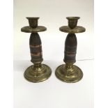 A pair of trench art shell candlesticks, approx 19