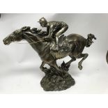 A Large cast resign figure of a reaching horse and