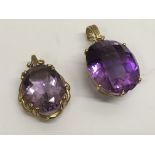 Two 9k gold pendant drops set with large amethysts
