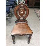 A small Victorian mahogany hall chair.