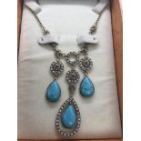 A Monet necklace with seed pearl and turquoise drops.