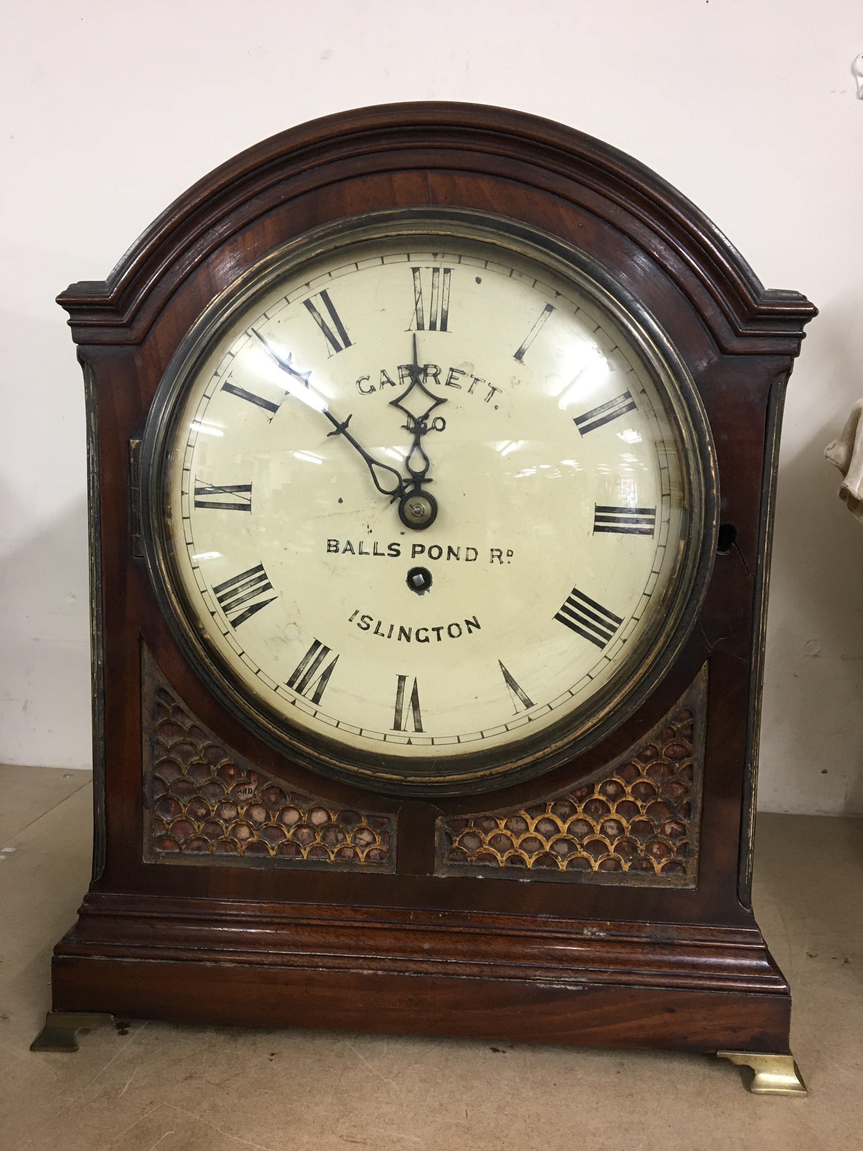 A Georgian mahogany bracket clock the painted dial with Roman numerals and named Garrett Balls