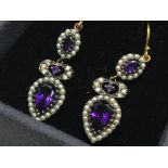 A set of drop earrings set with amethysts, seed pe