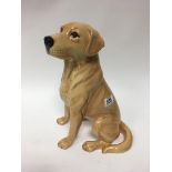 A large Beswick golden retriever figure.