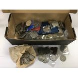 A box containing various coins.