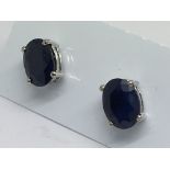 A pair of sapphire studs in silver