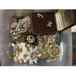 A box of mixed costume jewellery.