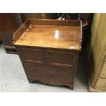 A small Edwardian mahogany buffet cabinet with gallery top