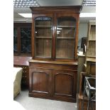 A large Victorian mahogany glazed front bookcase