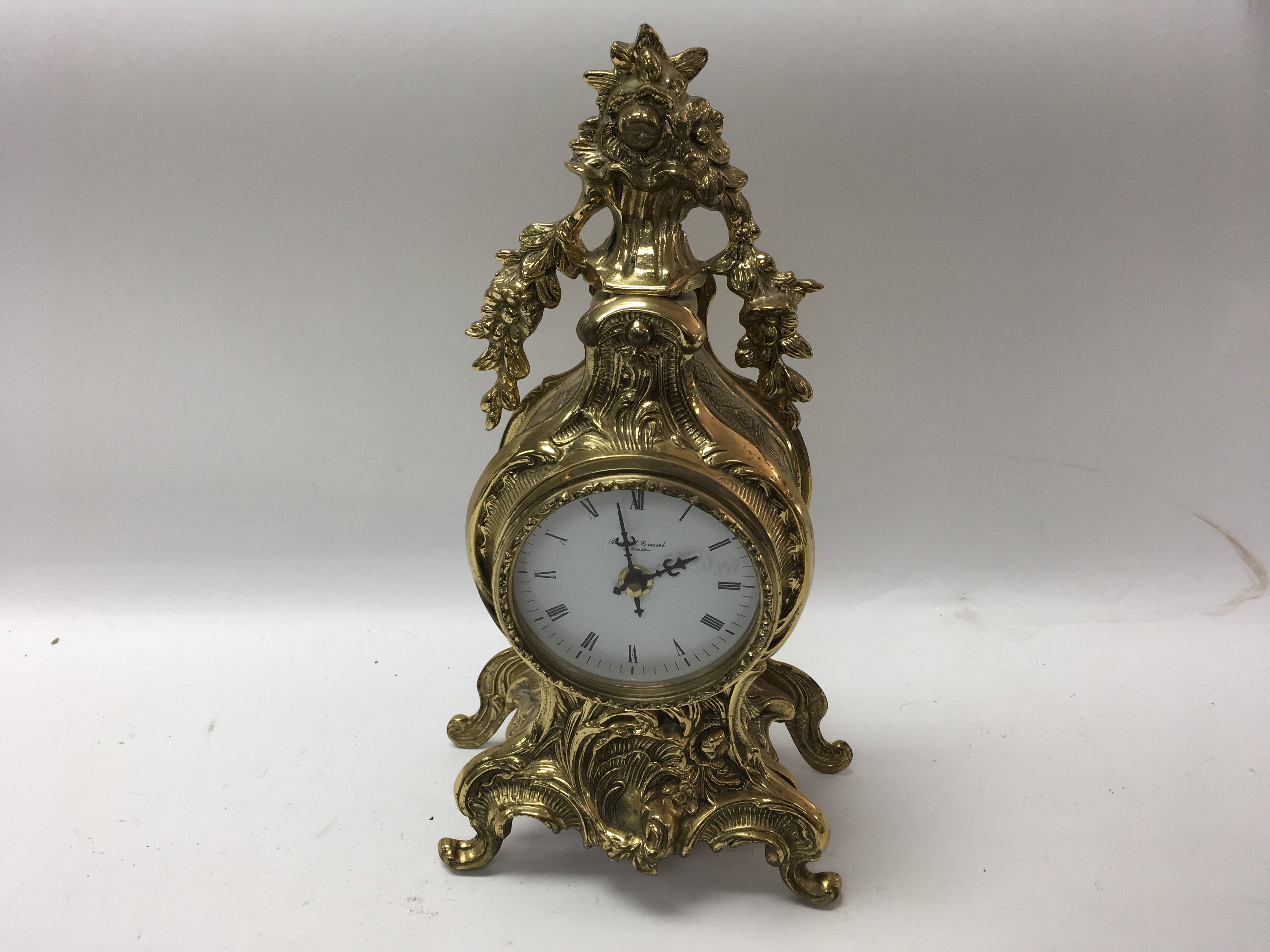 A 20th century brass mantle clock by Robert Grant