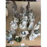 A collection of Nao and other porcelain figurines.