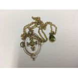 A 9ct gold Peridot and seed pearl pendant plus a 9