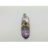 A 14ct gold quartz amethyst pendant, approx 7g.