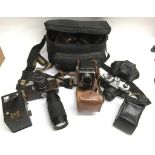 A collection of cameras including a Halina AI box