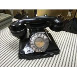 A 1930s black Bakelite pyramid telephone.