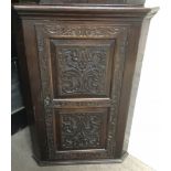 A large, carved oak corner cabinet.Approx 72x100x5