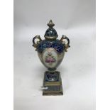 A small Noritake porcelain urn and cover.