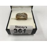 An 18ct two tone gold and diamond set ring.