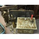 A collection of brass fireside items, brass surround mirror etc.